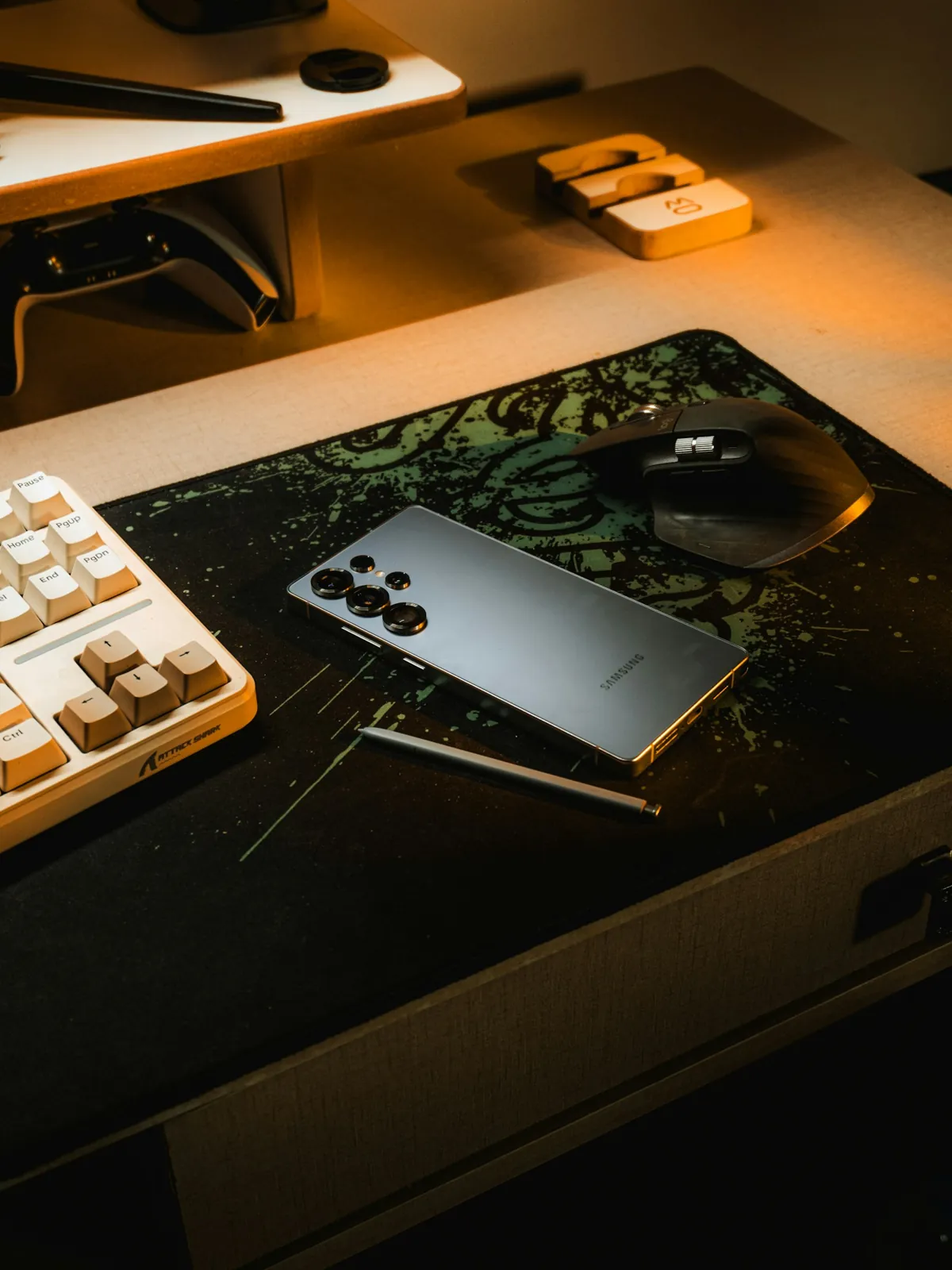 A smartphone on a desk in warm light